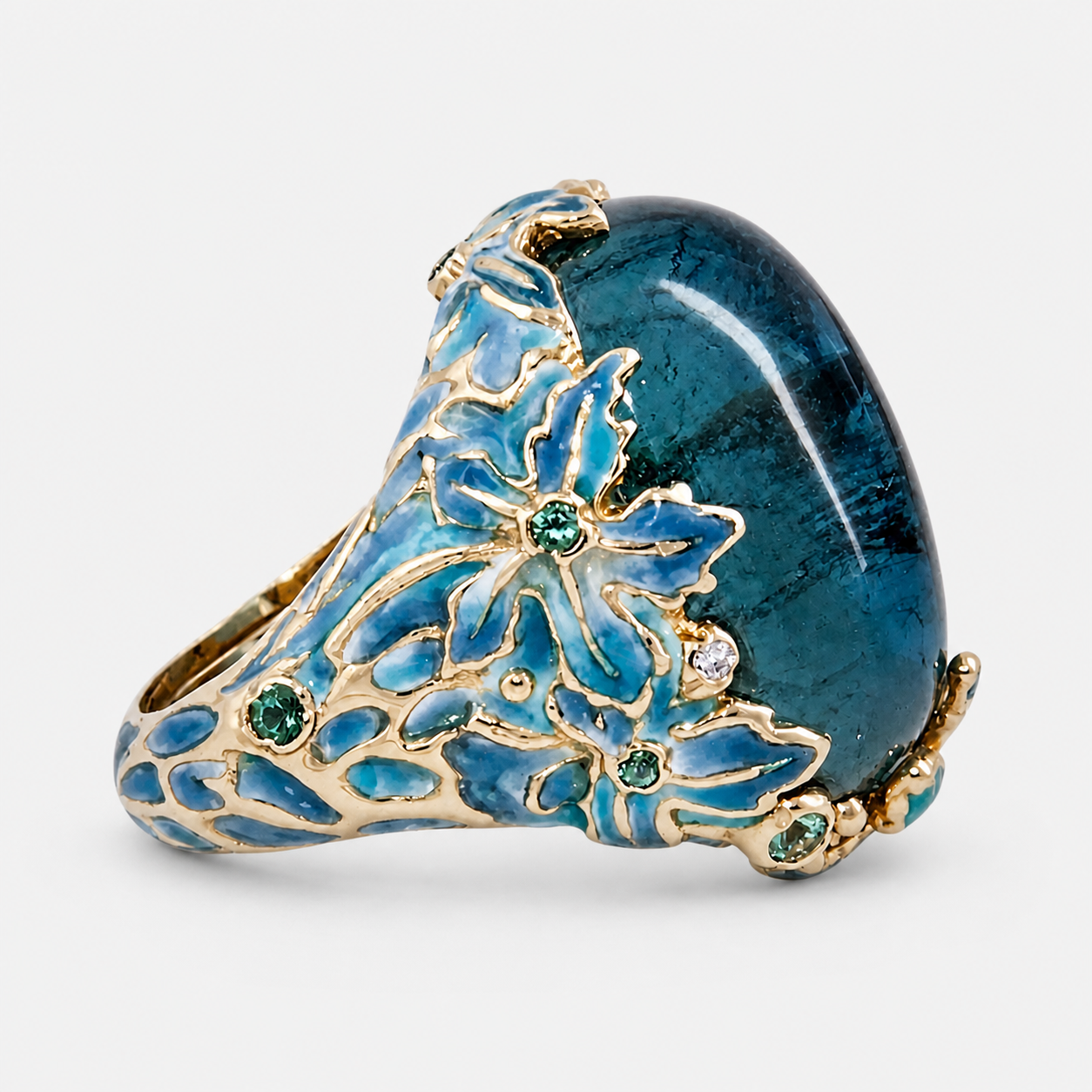 Elegant Gold Flower Blue Stone Ring on a light neutral studio background
