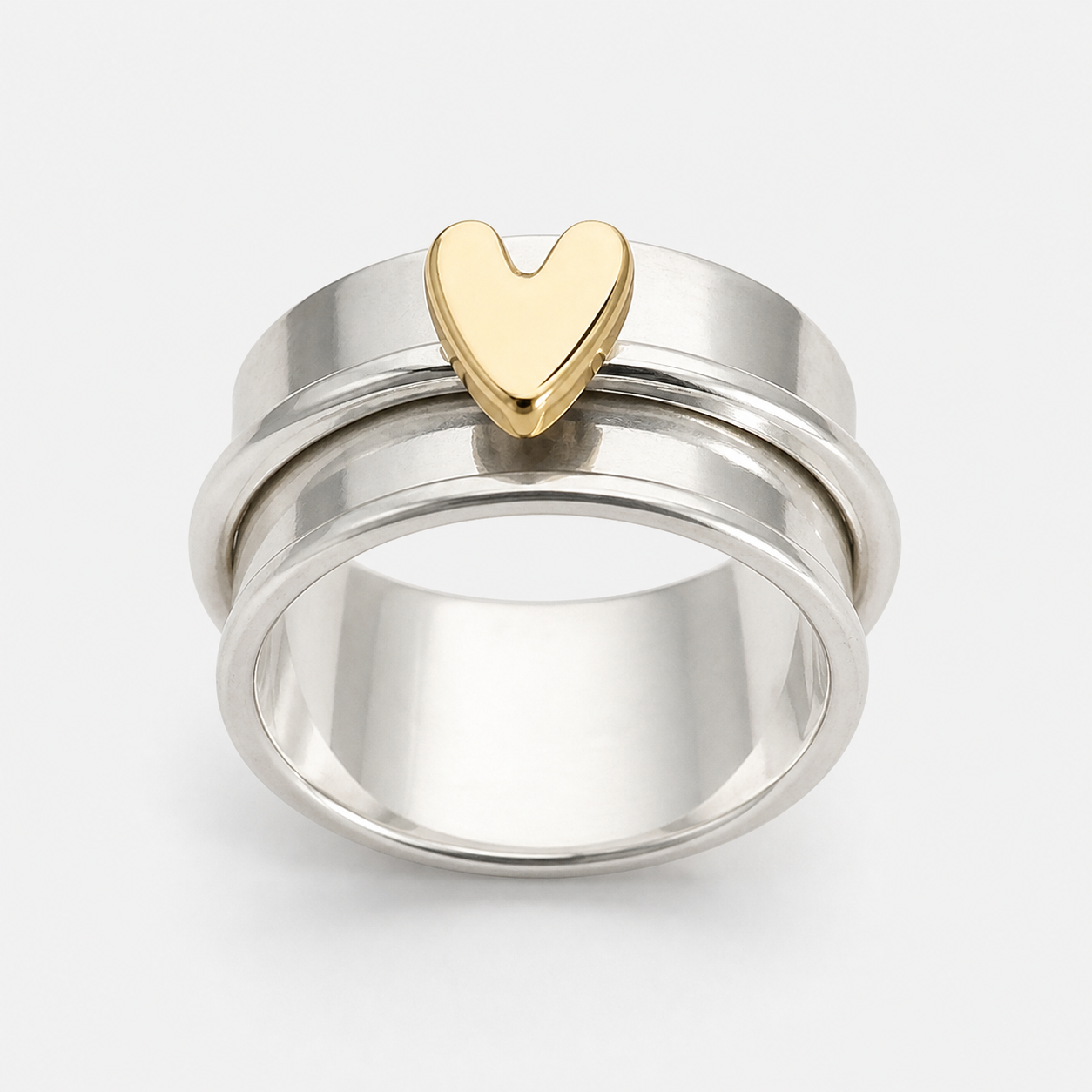 Vintage Silver Golden Heart Ring on a clean white studio background